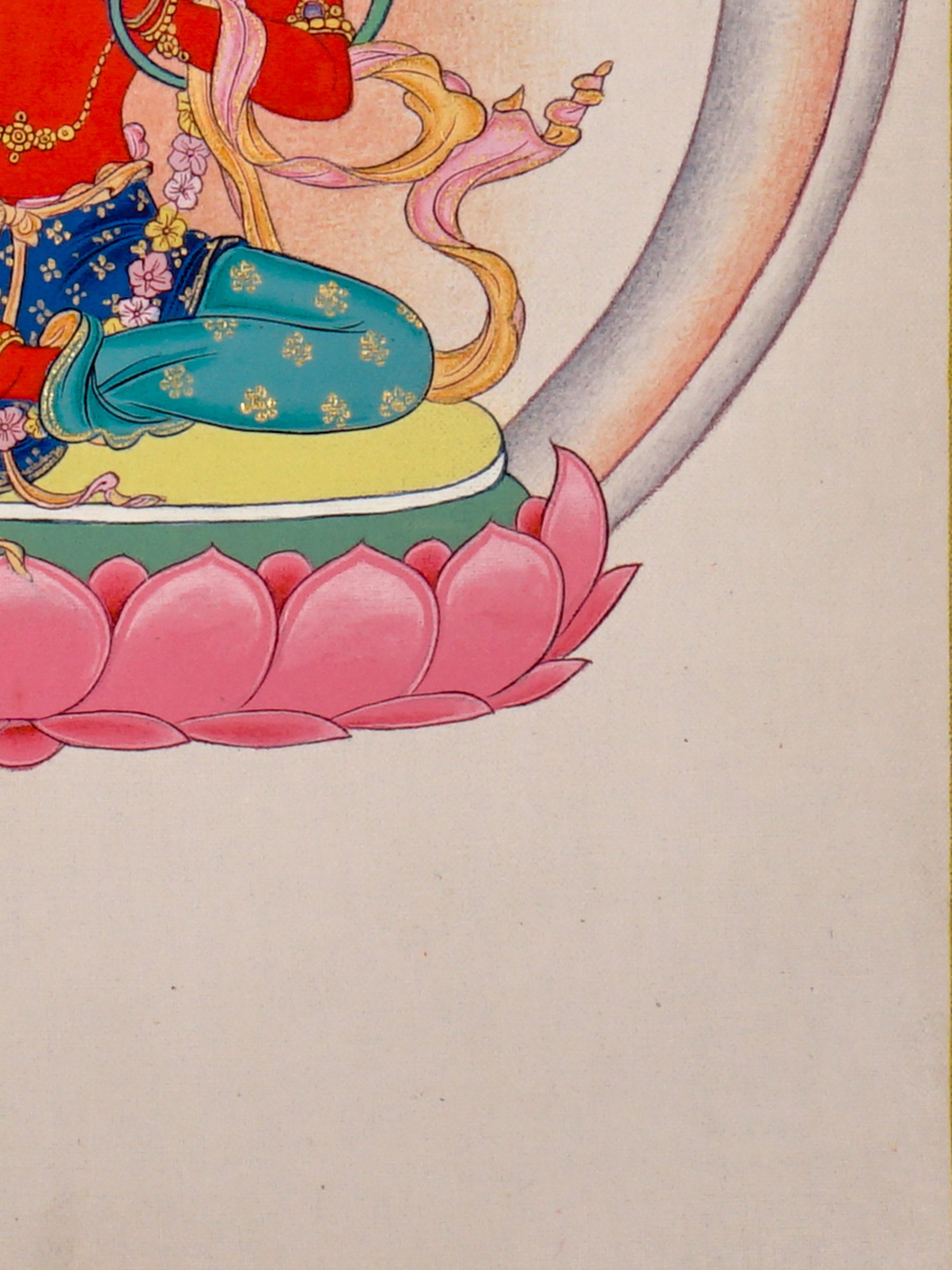 Red Tara thangka painting featuring Tara seated on a pink lotus throne with a lotus flower, radiant halo, ornaments