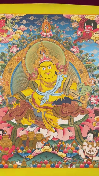 Yellow Zambhala thangka with Tibetan Buddhist wealth deity seated on lotus seat