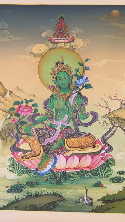 Green Tara thangka painting Tibetan goddess seated on lotus holding blue lotus in detailed Himalayan landscape