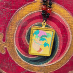 Lotus ghau pendant close up hand painted Himalayan spiritual art