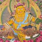 Yellow Zambhala thangka with Tibetan Buddhist wealth deity seated on lotus throne