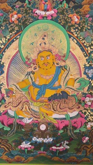 Yellow Zambhala thangka with prosperity deity seated on lotus throne