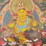 Yellow Zambhala thangka with Tibetan Buddhist wealth deity seated on lotus throne