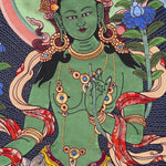 Green Tara thangka painting Tibetan goddess seated on lotus holding blue lotus in detailed traditional composition