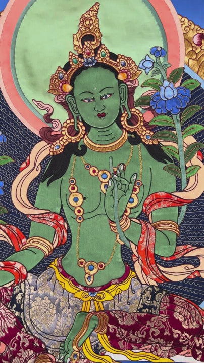 Green Tara thangka painting Tibetan goddess seated on lotus holding blue lotus in detailed traditional composition