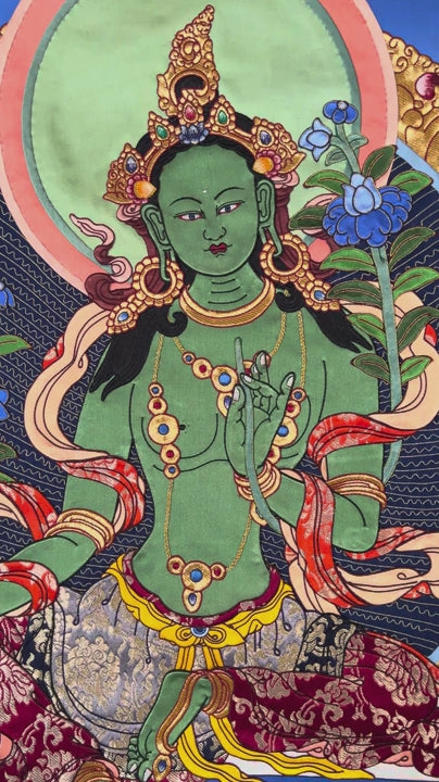 Green Tara thangka painting Tibetan goddess seated on lotus holding blue lotus in detailed traditional composition