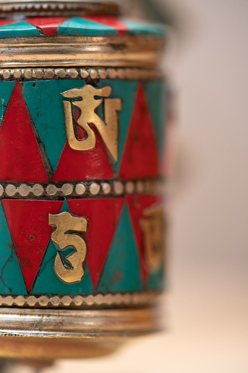 Prayer wheel with endless knot symbol for spiritual practice .