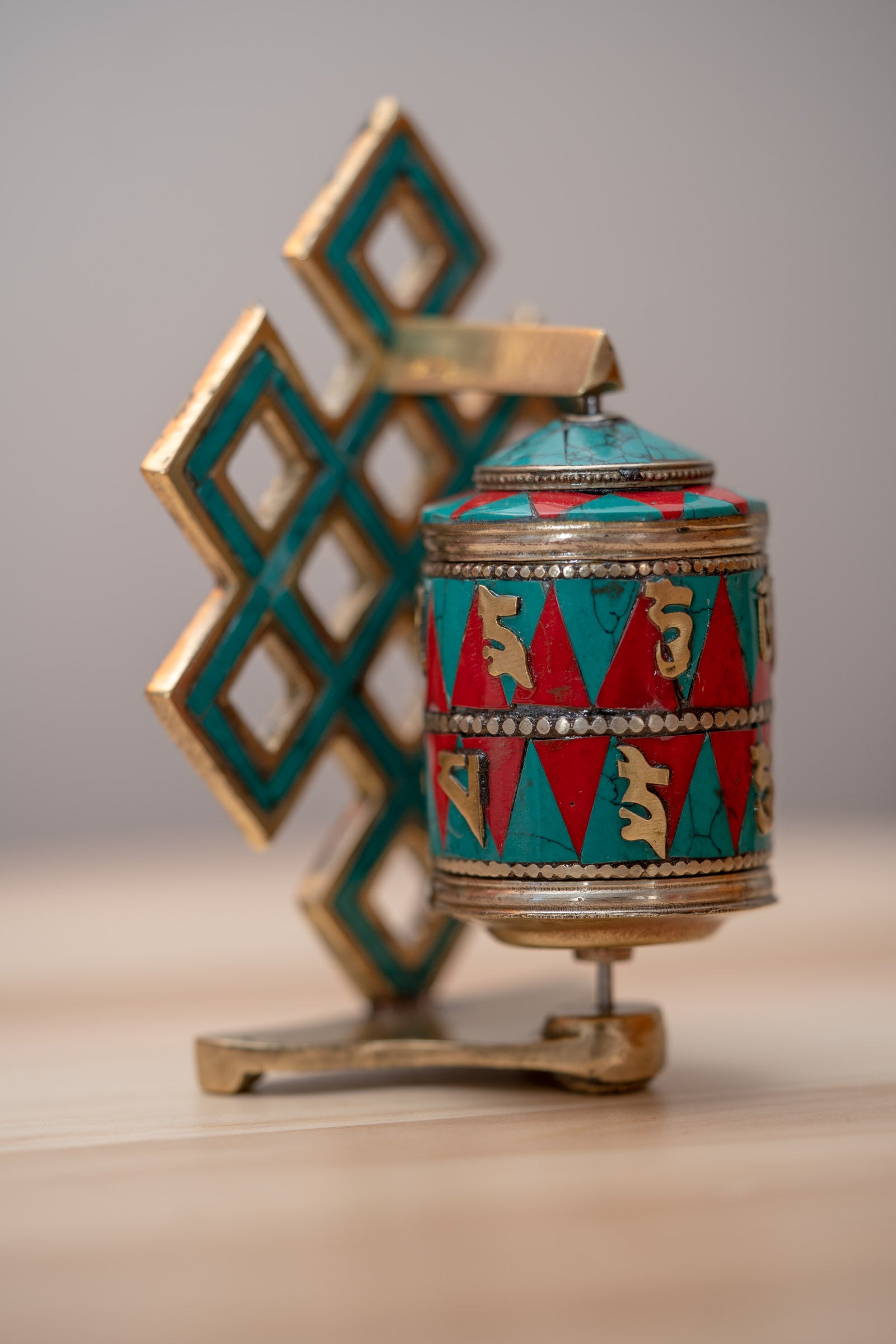 Prayer wheel with endless knot symbol for spiritual practice .