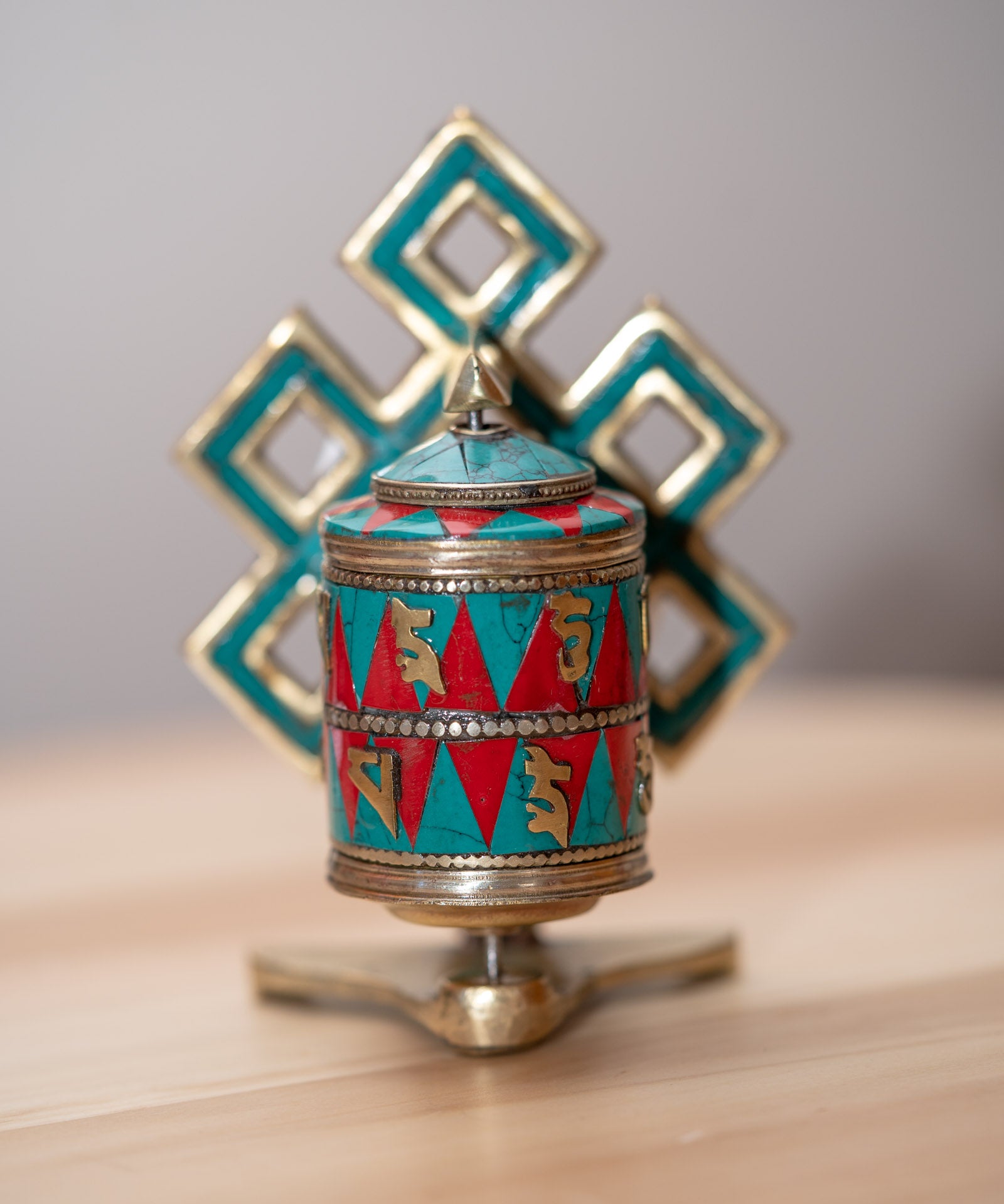 Prayer wheel with endless knot symbol for spiritual practice .