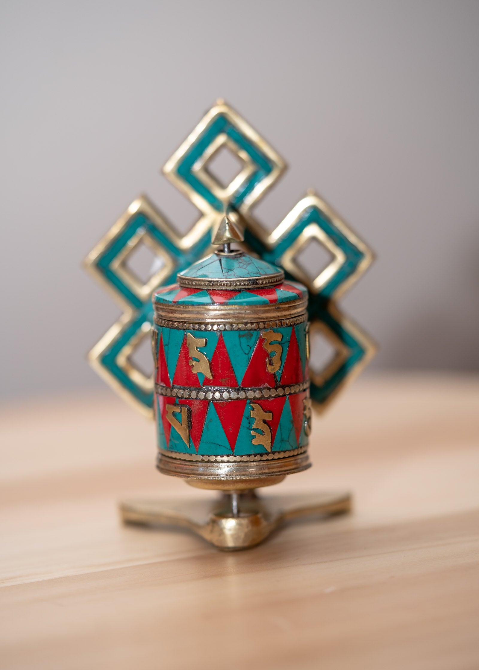 Prayer wheel with endless knot symbol for spiritual practice .