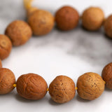 Himalayan singing bowl, prayer flag and bodhi seed bracelets for deep meditation, a perfect spiritual gift for father's day celebration.