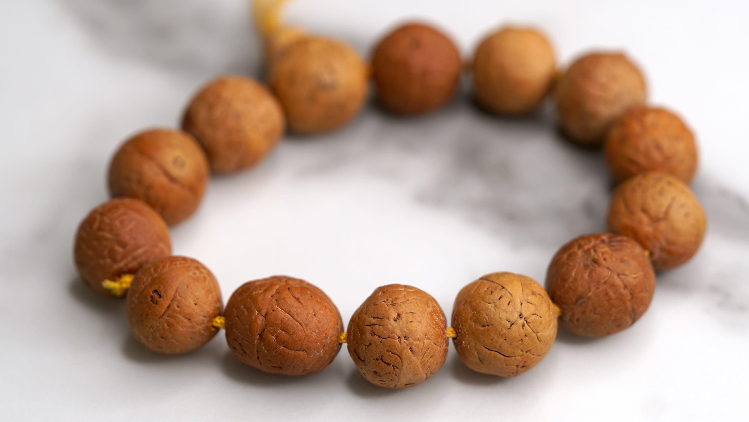 Himalayan singing bowl, prayer flag and bodhi seed bracelets for deep meditation, a perfect spiritual gift for father's day celebration.