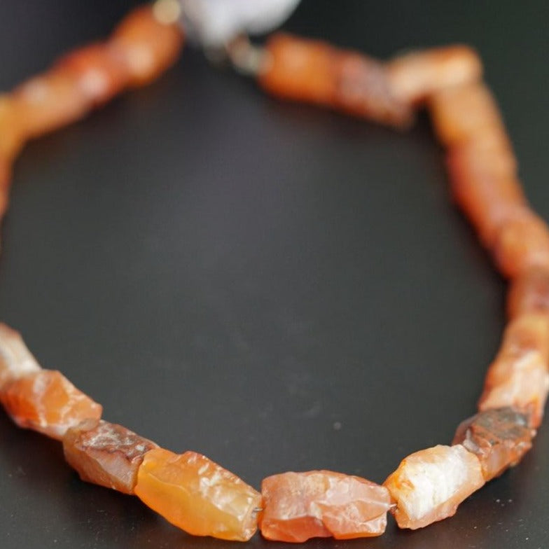 Raw Carnelian crystal necklace for healing sacral chakra