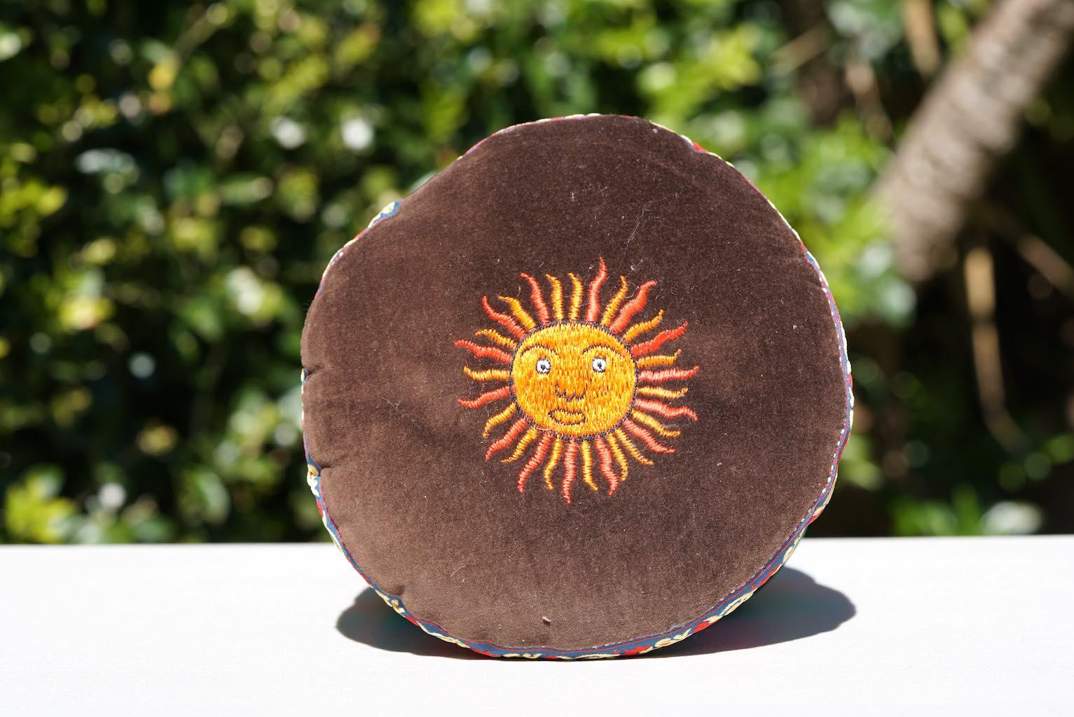sun in singing bowl cushion hand embroidery 