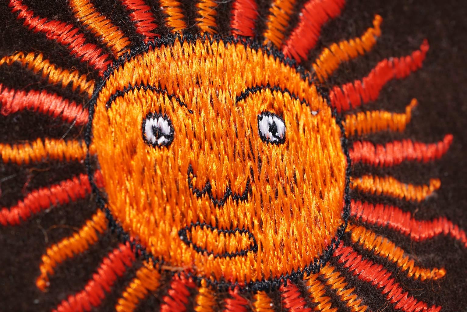 Sun  hand embroidery on cushion
