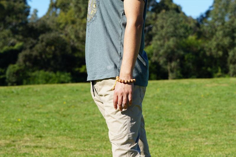 Himalayan singing bowl, prayer flag and bodhi seed bracelets for deep meditation, a perfect spiritual gift for father's day celebration.
