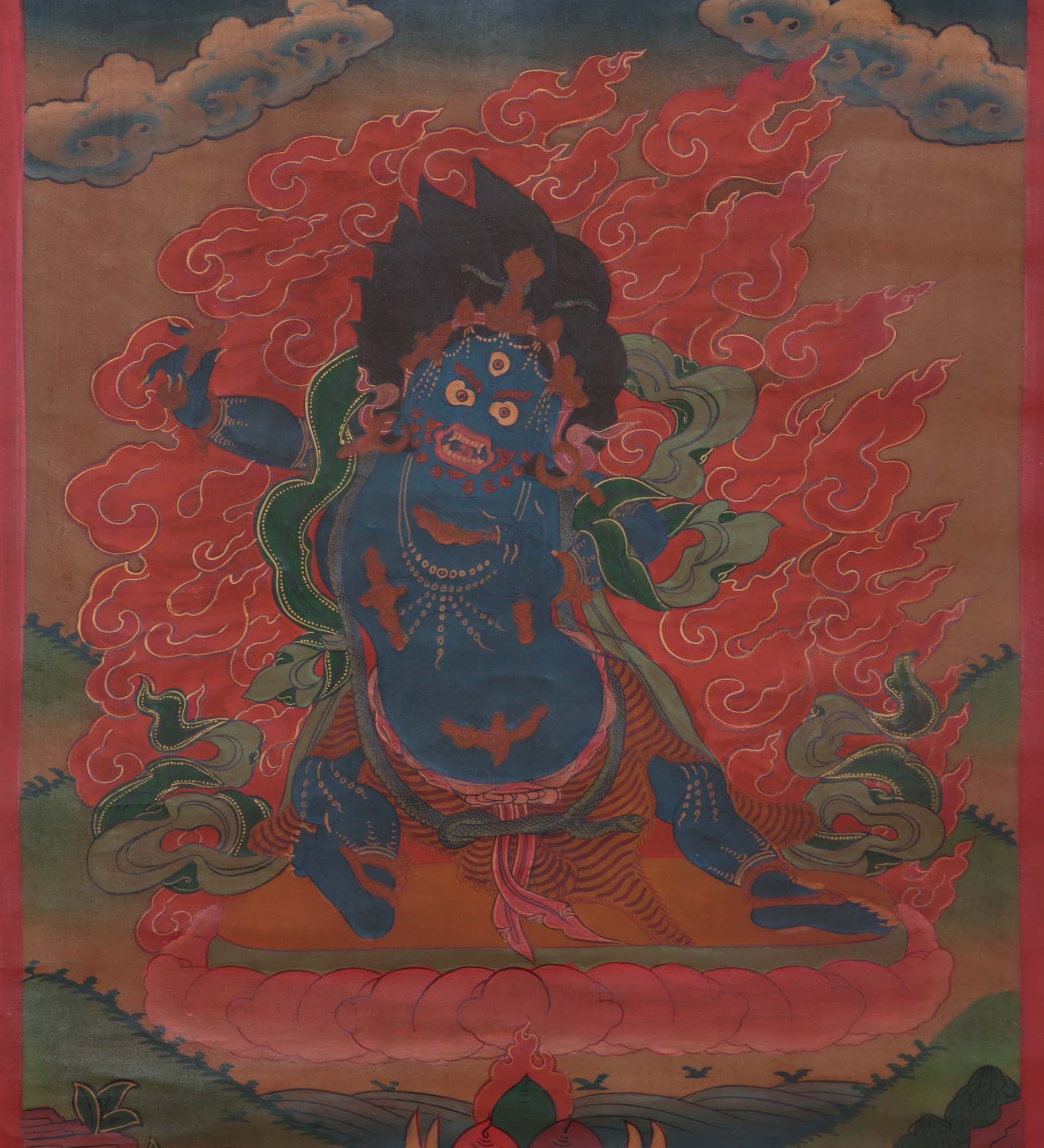 Vajrapani thangka art depicts a powerful Buddhist deity, holding a vajra (thunderbolt) in one hand and a lasso in the other. His fierce expression represents his ability to conquer obstacles and protect against negative influences.