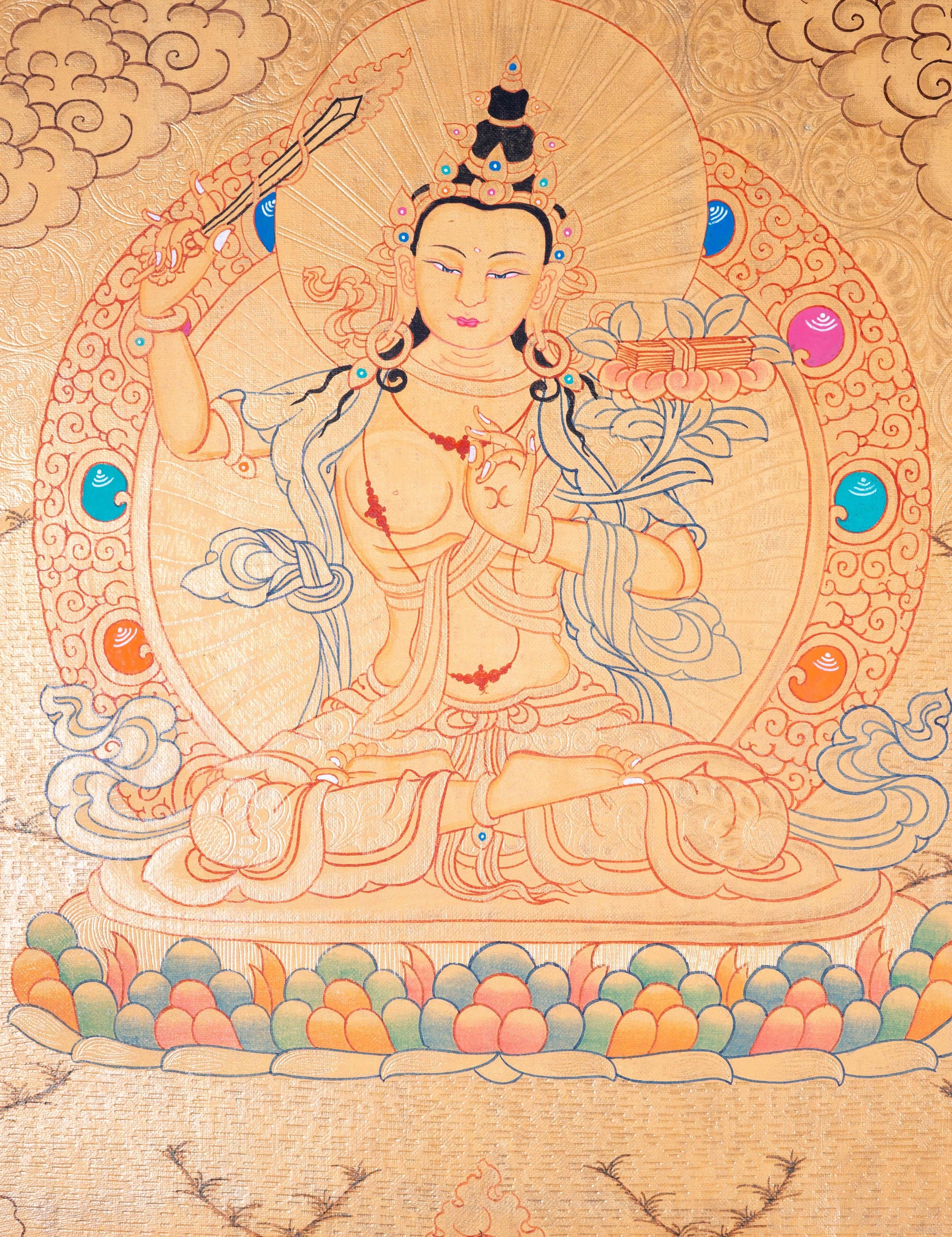 Buddhist Thangka are used as support for one's meditation practice. Manjushri is the Bodhisattva of transcendent wisdom. With the double-edged sword on his right hand he cuts through the illusion and with his left hand holds a lotus with book of Prajna Paramita.