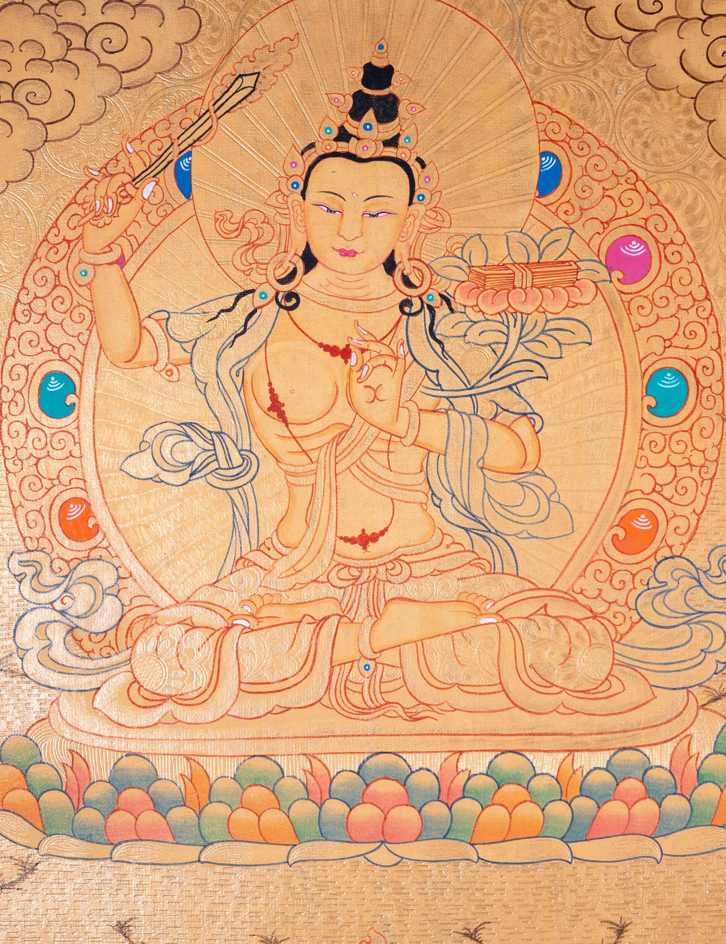 Buddhist Thangka are used as support for one's meditation practice. Manjushri is the Bodhisattva of transcendent wisdom. With the double-edged sword on his right hand he cuts through the illusion and with his left hand holds a lotus with book of Prajna Paramita.