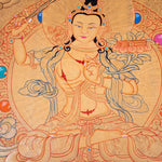 Buddhist Thangka are used as support for one's meditation practice. Manjushri is the Bodhisattva of transcendent wisdom. With the double-edged sword on his right hand he cuts through the illusion and with his left hand holds a lotus with book of Prajna Paramita.