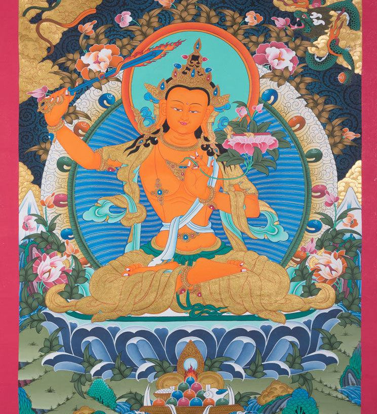Manjushri is the Bodhisattva of transcendent wisdom. With the double-edged  sword on his right hand he cuts through the illusion and with his left hand holds a lotus with book of Prajna Paramita. 