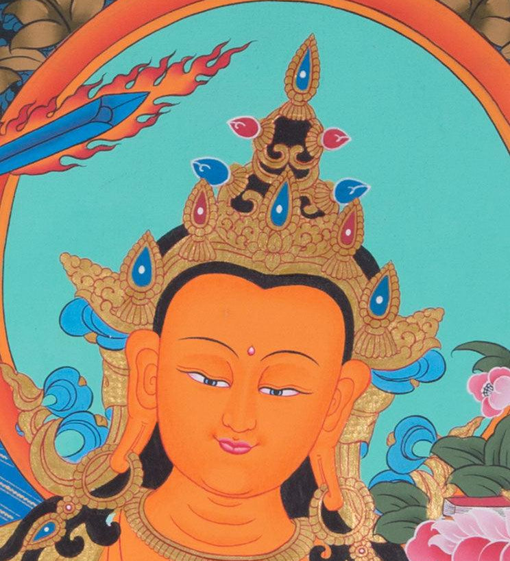 Manjushri is the Bodhisattva of transcendent wisdom. With the double-edged  sword on his right hand he cuts through the illusion and with his left hand holds a lotus with book of Prajna Paramita. 