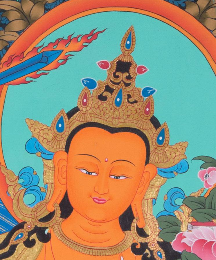 Manjushri is the Bodhisattva of transcendent wisdom. With the double-edged  sword on his right hand he cuts through the illusion and with his left hand holds a lotus with book of Prajna Paramita. 