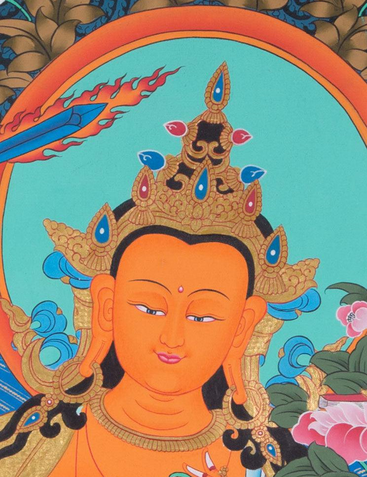 Manjushri is the Bodhisattva of transcendent wisdom. With the double-edged  sword on his right hand he cuts through the illusion and with his left hand holds a lotus with book of Prajna Paramita. 