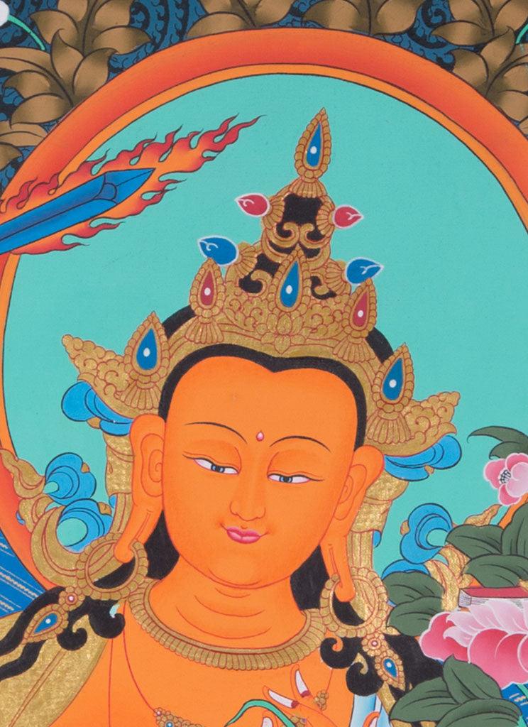 Manjushri is the Bodhisattva of transcendent wisdom. With the double-edged  sword on his right hand he cuts through the illusion and with his left hand holds a lotus with book of Prajna Paramita. 