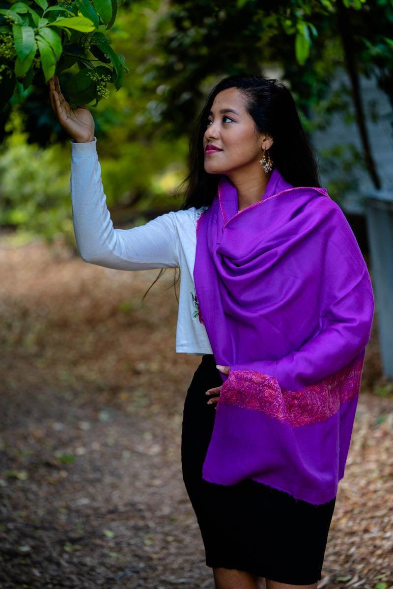 Holding a leaf of a tree wearing a stylish purple pashmina