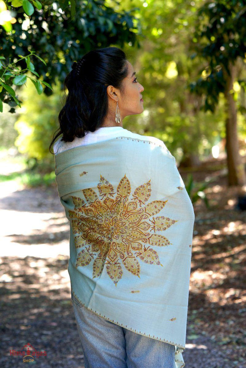 All our pashmina shawl are hand embroidered and unique. This is flower embroidered with gold thread on aqua turquoise shawl. You will surely fall in love with this work!