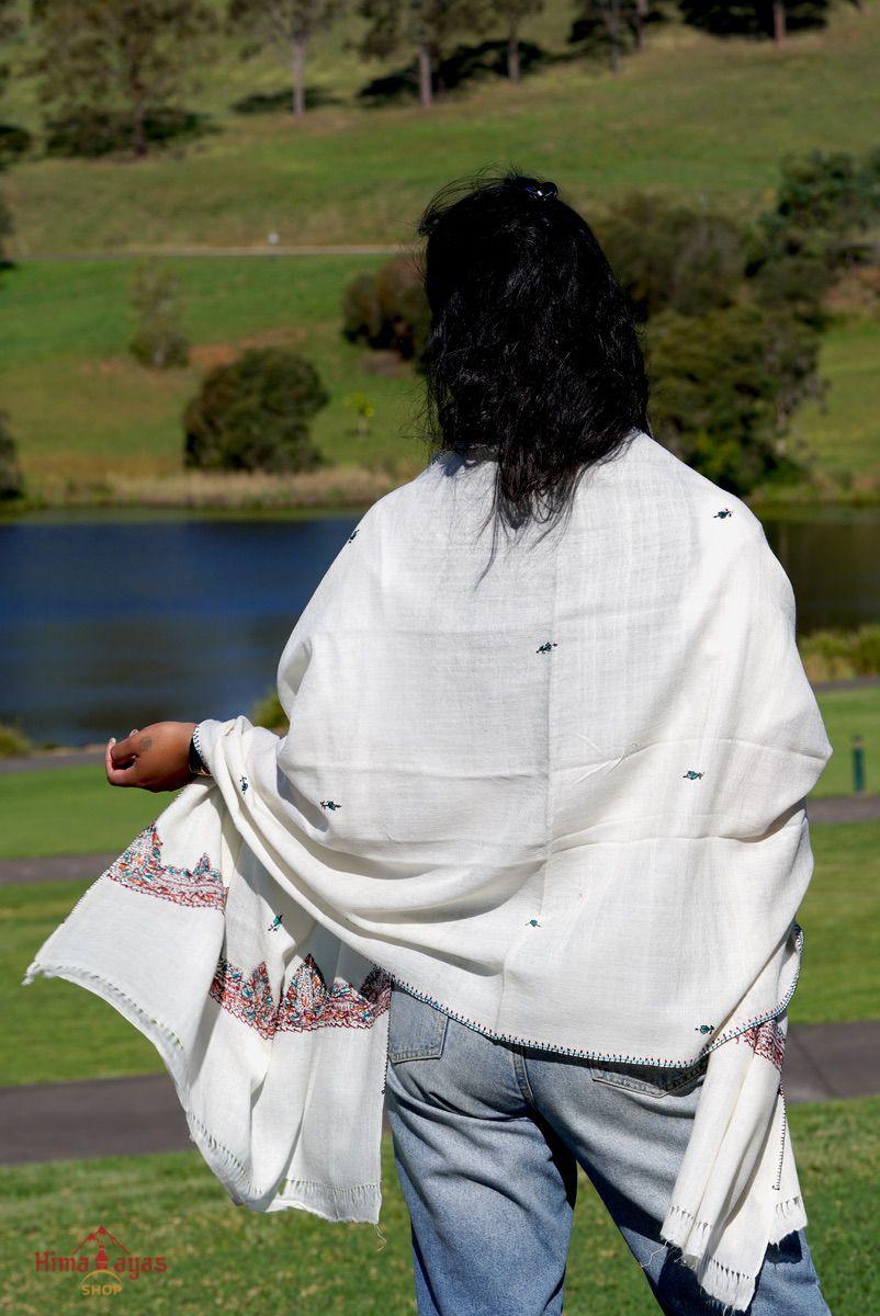 This shawl is very light in weight with little embroidered work , it is simple and elegant. White color pashmina shawl for everyday use.