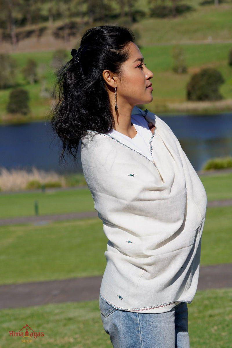 This shawl is very light in weight with little embroidered work , it is simple and elegant. White color pashmina shawl for everyday use.