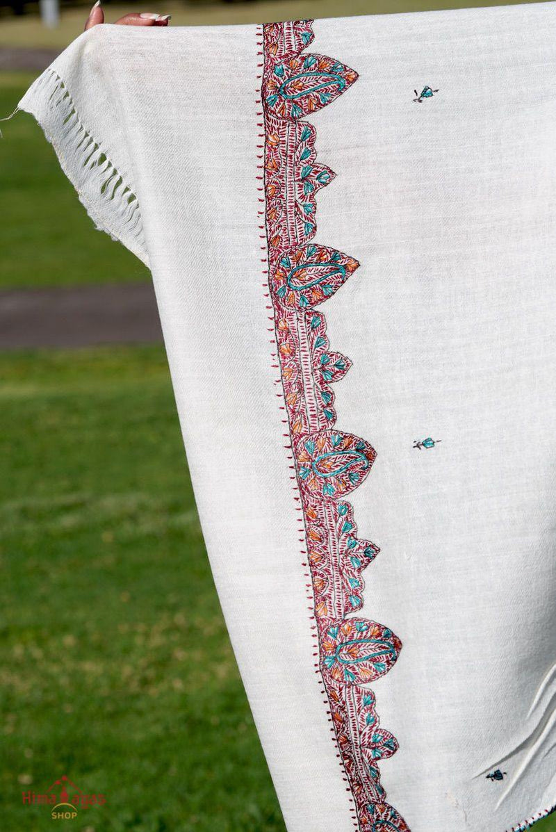 This shawl is very light in weight with little embroidered work , it is simple and elegant. White color pashmina shawl for everyday use.