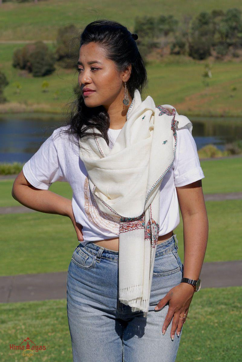 This shawl is very light in weight with little embroidered work , it is simple and elegant. White color pashmina shawl for everyday use.