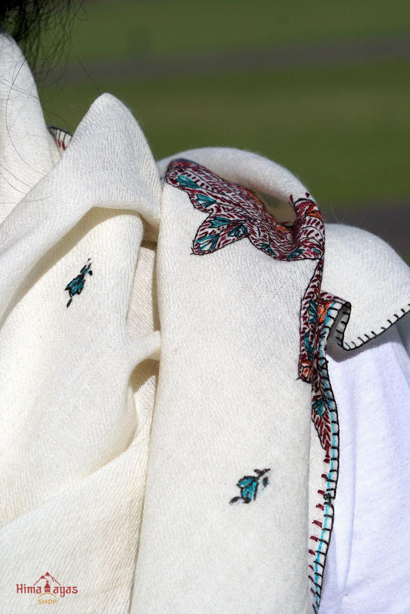 This shawl is very light in weight with little embroidered work , it is simple and elegant. White color pashmina shawl for everyday use.