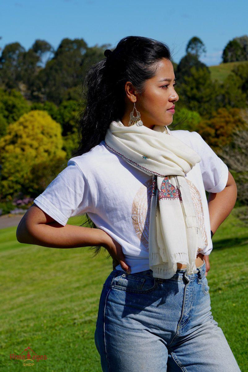 This shawl is very light in weight with little embroidered work , it is simple and elegant. White color pashmina shawl for everyday use.