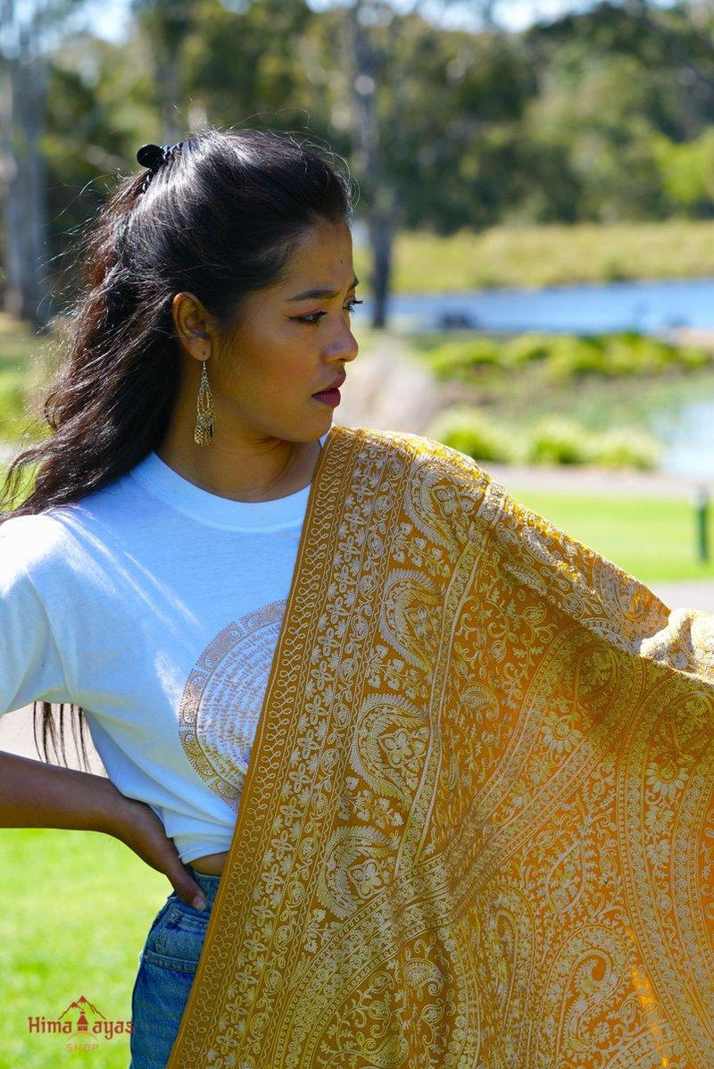 100% pashmina shawl with sunshine yellow and gold embroidery perfect for elegant looks. Ethically sourced and biodegradable material.