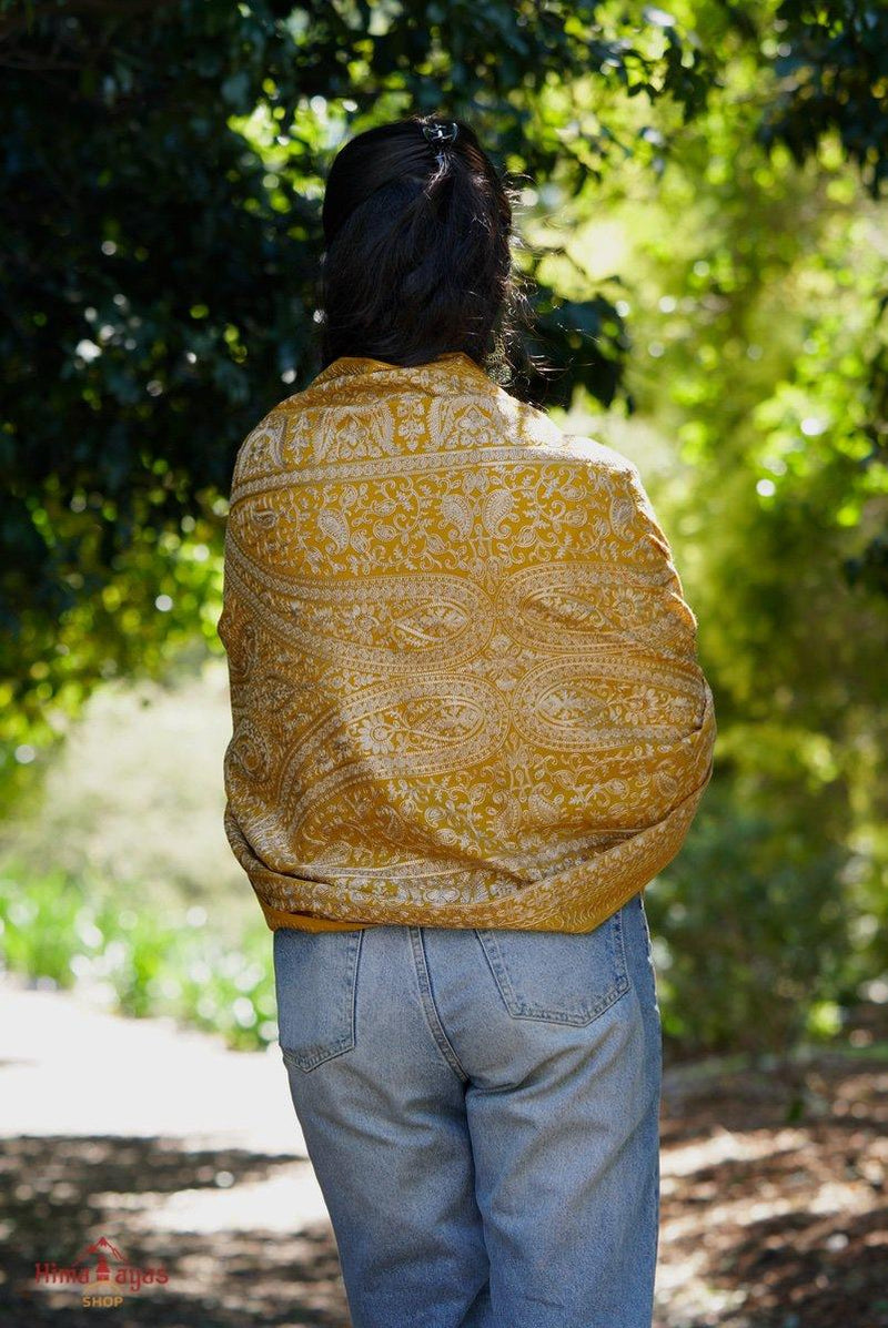100% pashmina shawl with sunshine yellow and gold embroidery perfect for elegant looks. Ethically sourced and biodegradable material.