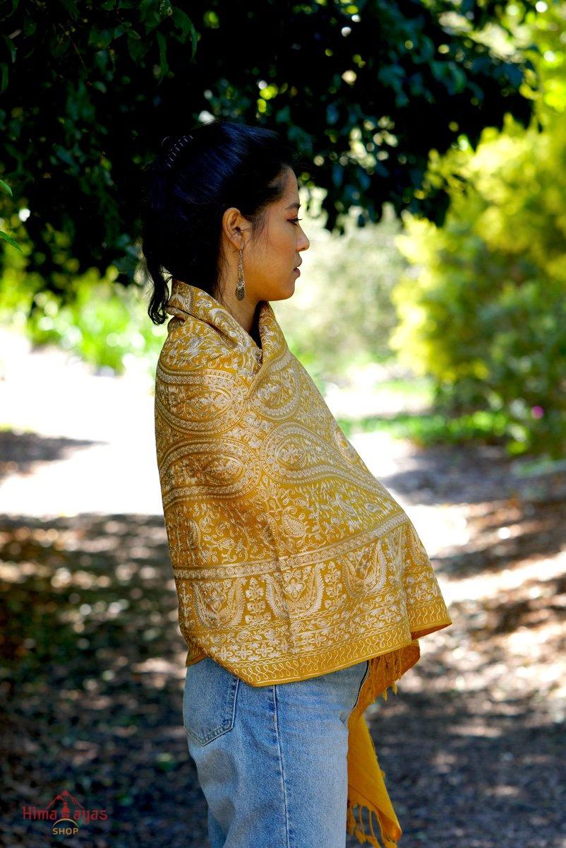 100% pashmina shawl with sunshine yellow and gold embroidery perfect for elegant looks. Ethically sourced and biodegradable material.