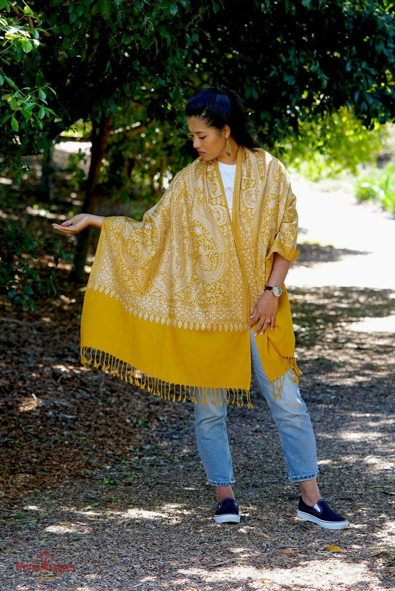 100% pashmina shawl with sunshine yellow and gold embroidery perfect for elegant looks. Ethically sourced and biodegradable material. 