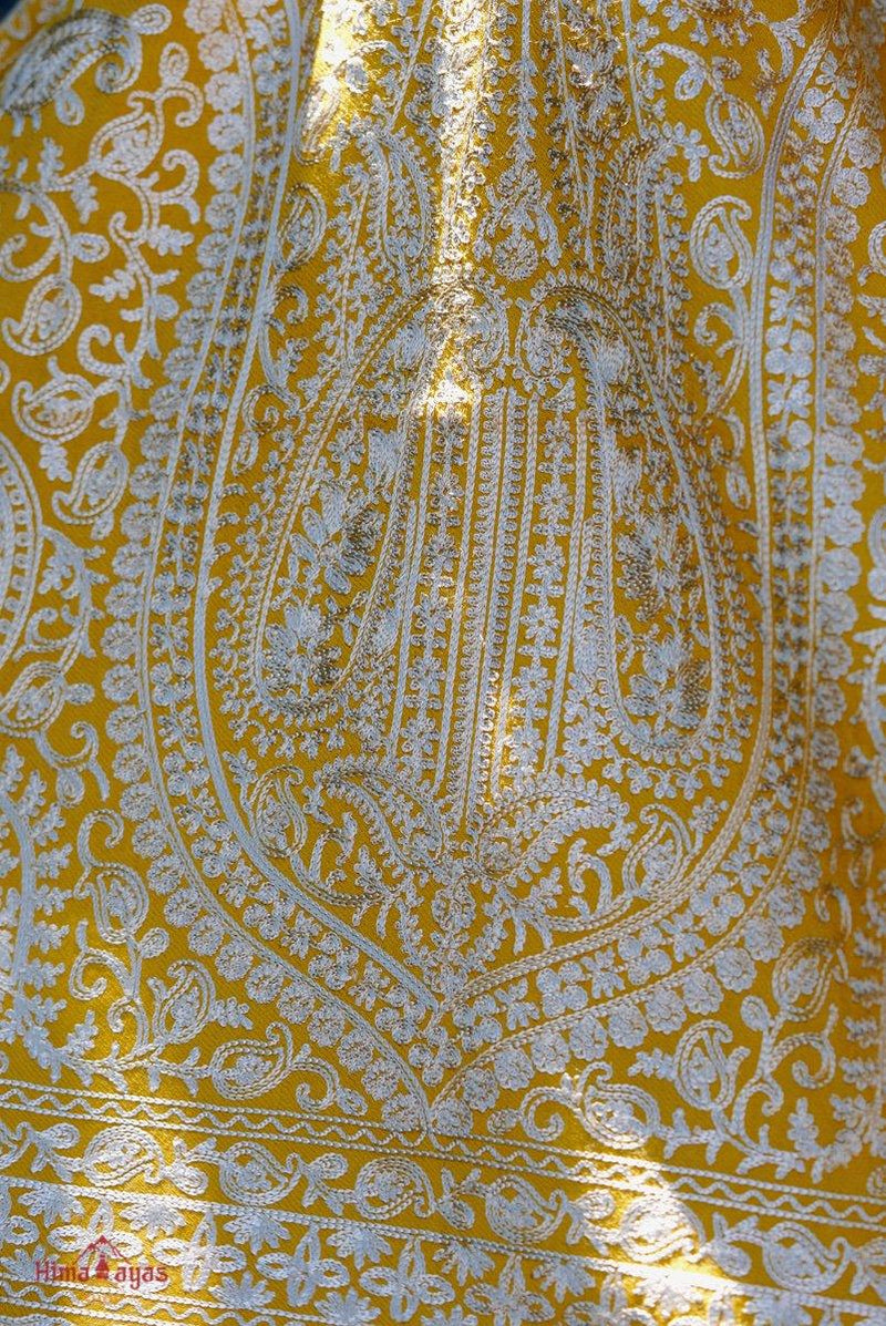 100% pashmina shawl with sunshine yellow and gold embroidery perfect for elegant looks. Ethically sourced and biodegradable material.