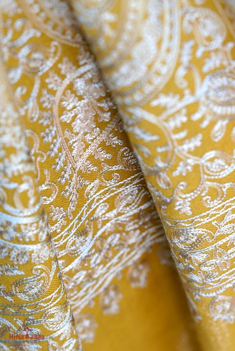 100% pashmina shawl with sunshine yellow and gold embroidery perfect for elegant looks. Ethically sourced and biodegradable material.