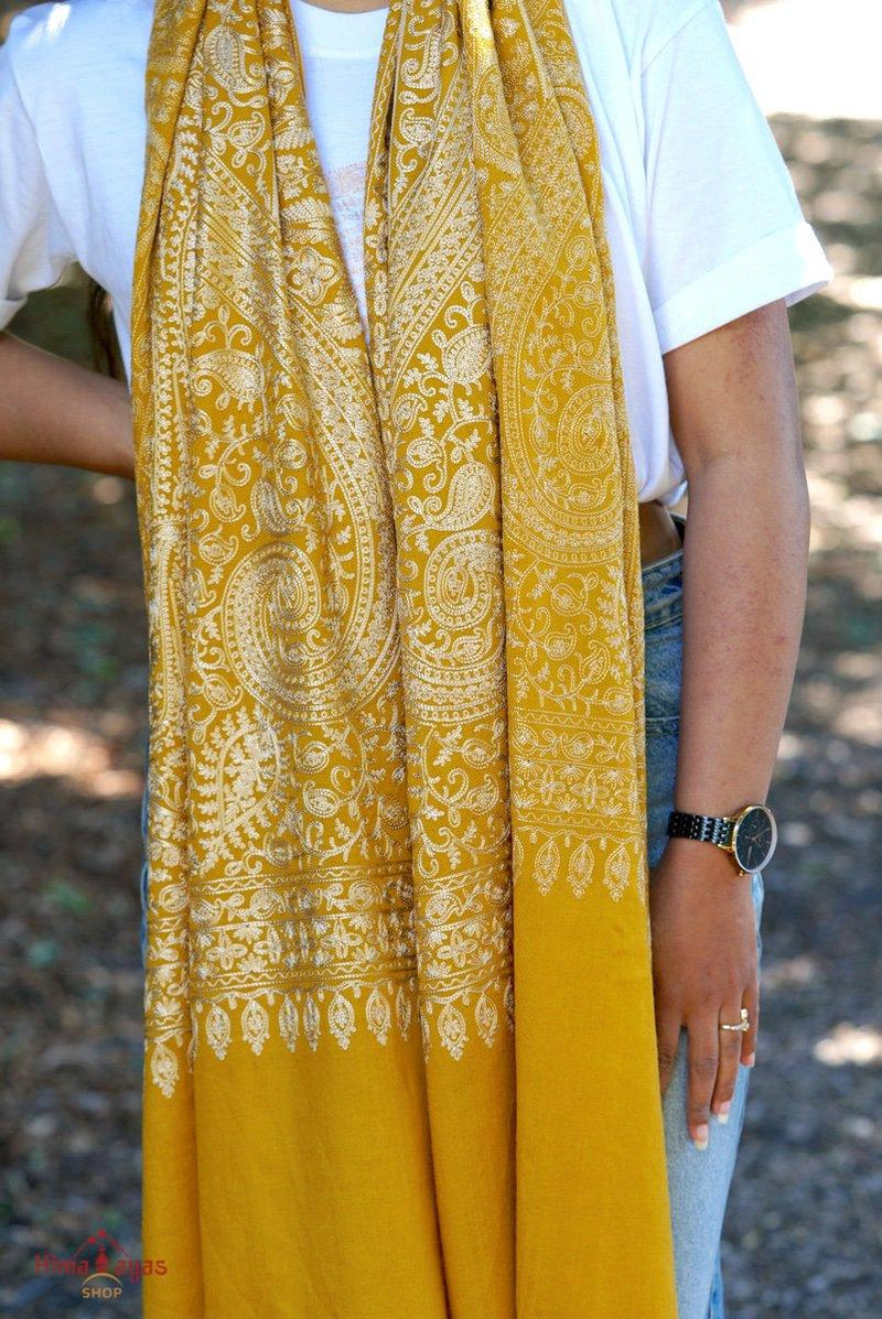 100% pashmina shawl with sunshine yellow and gold embroidery perfect for elegant looks. Ethically sourced and biodegradable material.