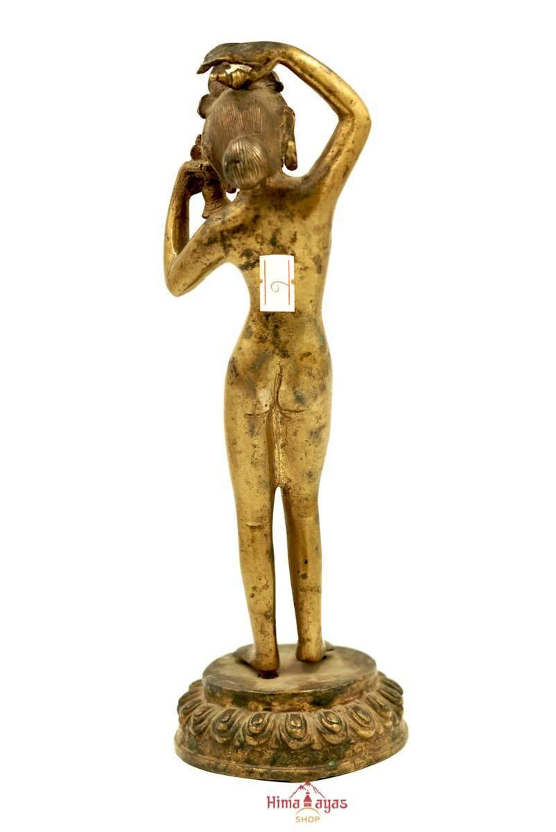 Antique old Statue of Standing Dakini with Bell standing on a lotus