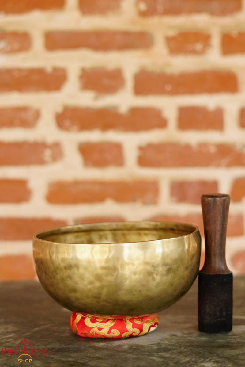Singing Bowl and a mallet for sale