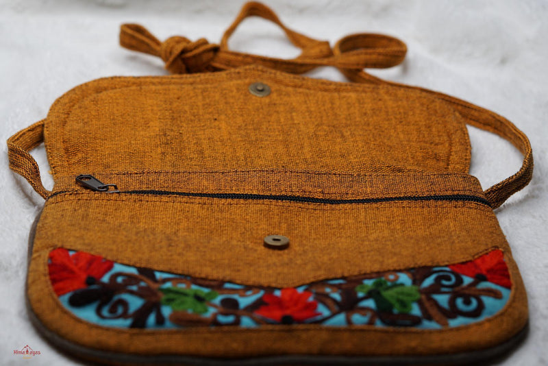 Easy to carry side bag for women, features a beautiful hand embroidered floral pattern. 