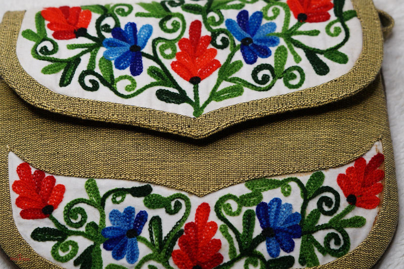A classic women's hanmade bag, crafted with beautiful cashmere floral embroidery to give it a chic stylish look.
