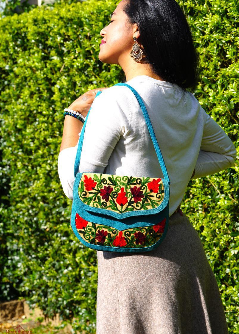 Beautiful handmade women's crossbody bag with floral embroidery design for chic boho style. 