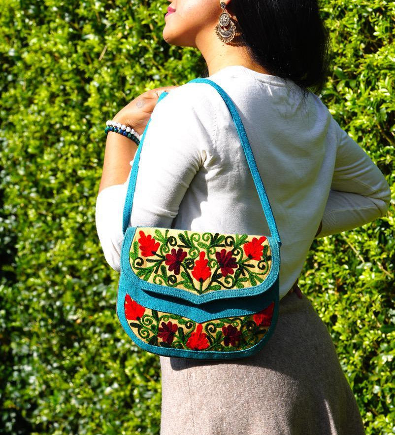Beautiful handmade women's crossbody bag with floral embroidery design for chic boho style. 